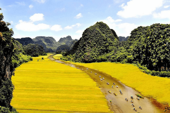 tourists on the river at Tam Oc in Vietnam