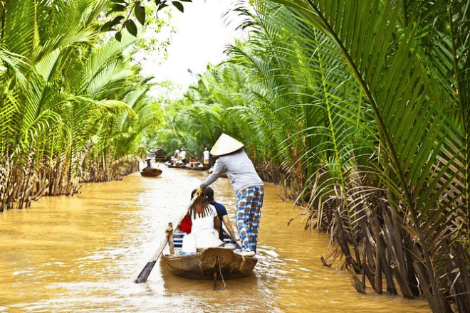 boat with tourist inside the river of the mekong delta