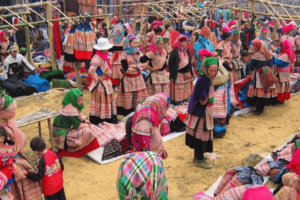 "Meo Vac Market in Ha Giang with local vendors and ethnic textiles."
