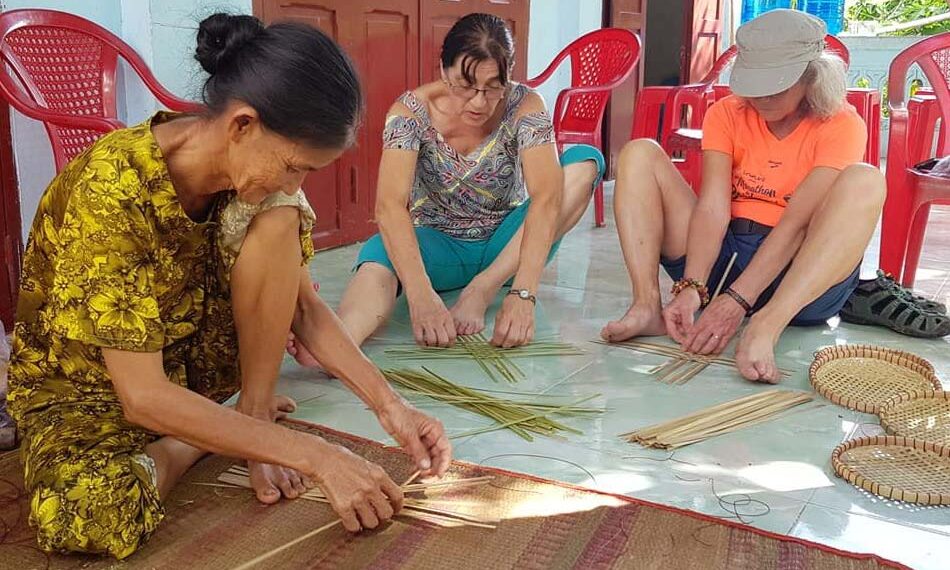 tourist cook with locals in Vietnam